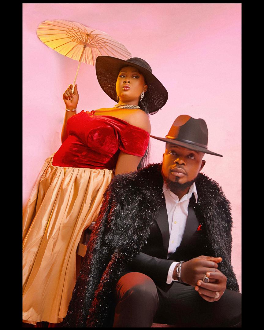 Vintage-styled couple with a parasol and fedora