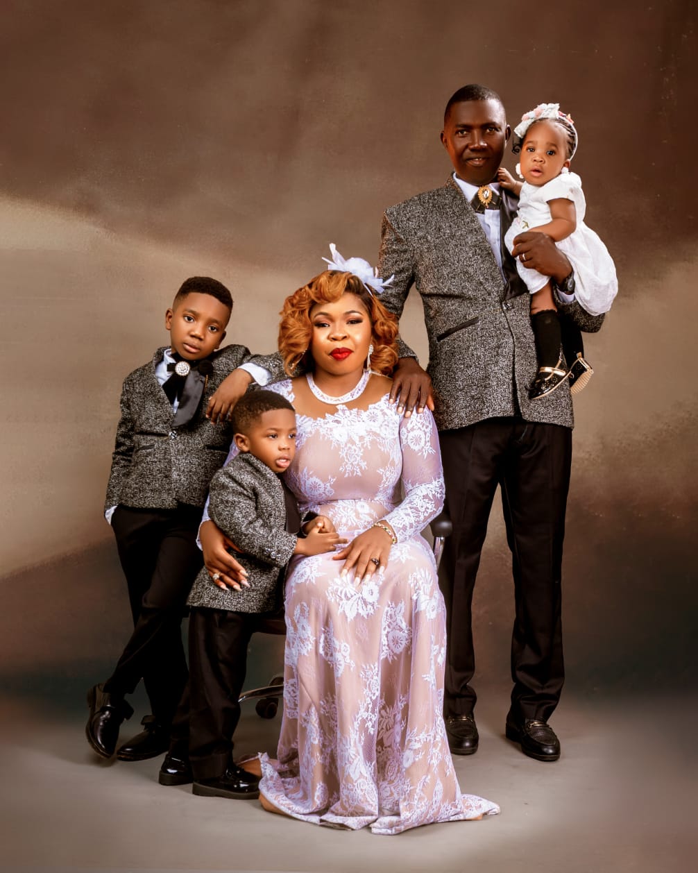 Family of five in tweed and white lace